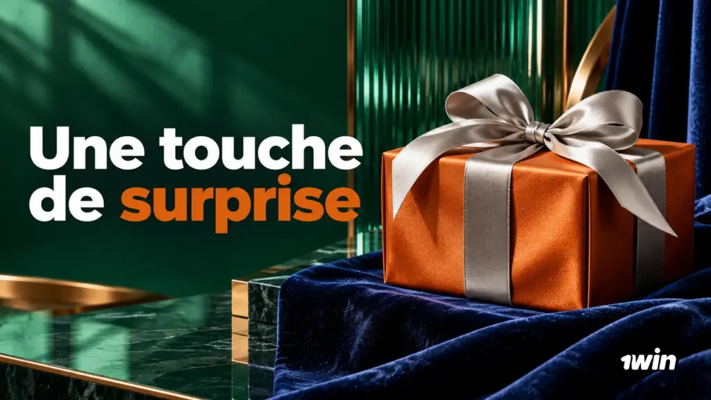 Cadeau orange avec un ruban argenté sur un tissu bleu
